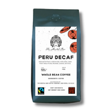 Coffee bag labeled 'Peru Decaf' with branding and certification logos on a white background