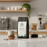 Coffee bag labeled 'Quiet Storm' on a kitchen counter with coffee-making equipment.
