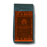 Mogul Mountain medium roast coffee offering dark chocolate, almond, and toffee flavors.