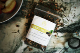 Sunbeam herbal tea blend with lemon verbena, lemongrass, ginger root, and hibiscus in premium packaging.